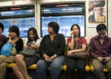 People on Bus with Cellphones